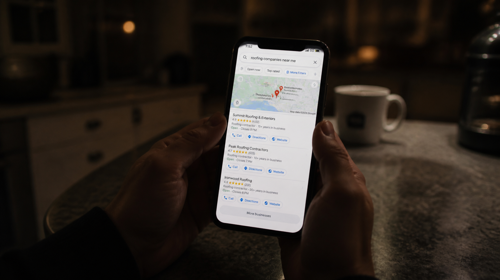 Homeowner holding a phone showing a Google Maps search with three roofing company pins at the top of the results