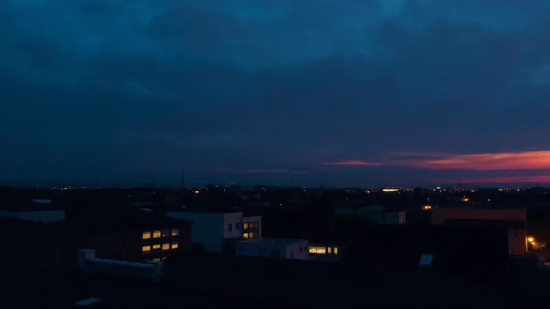 Dark rooftop skyline at dusk with subtle glowing data lines representing AI search visibility